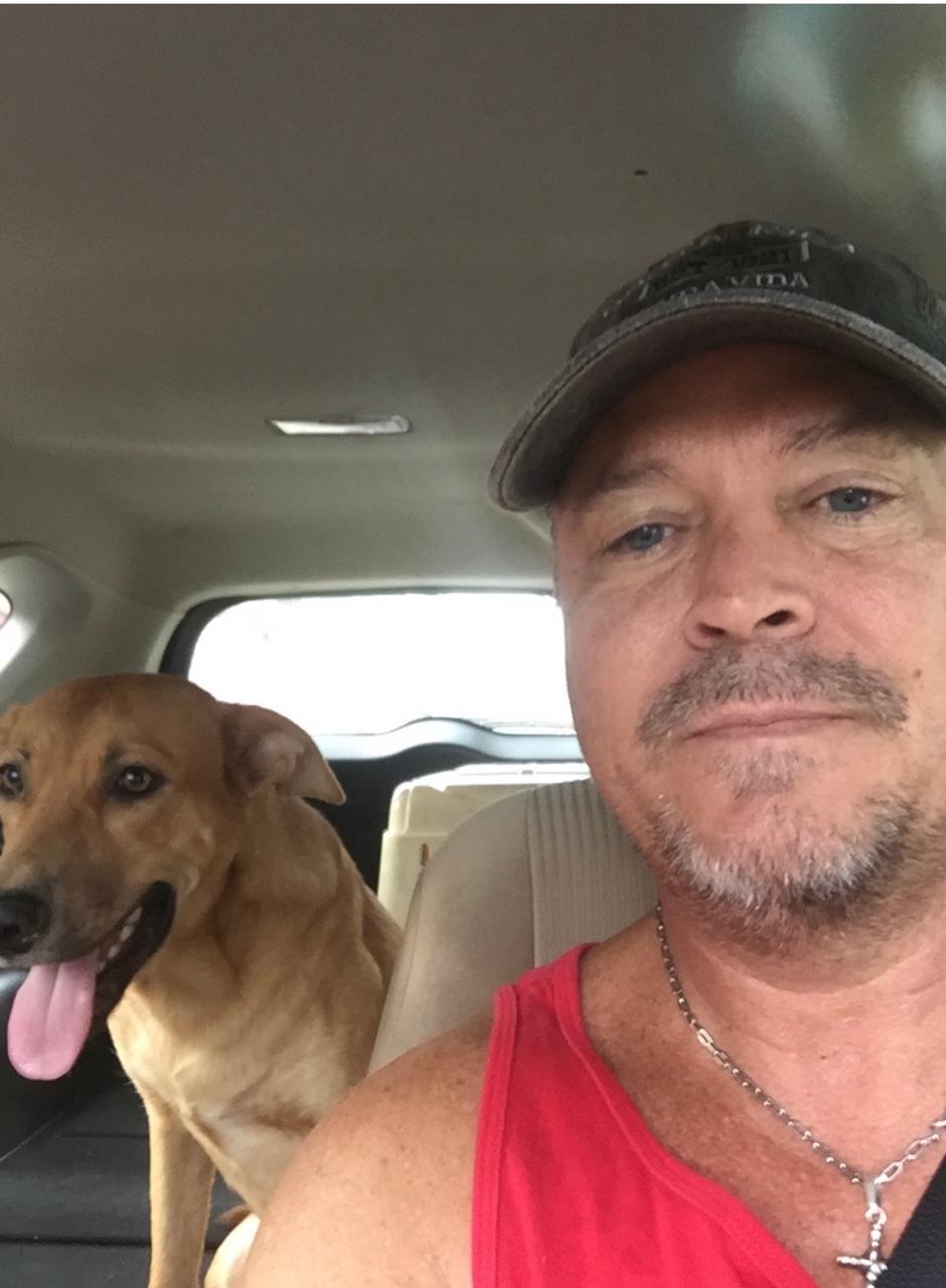 Mike Stooksbury with Chico, the first street dog he rescued in Costa Rica